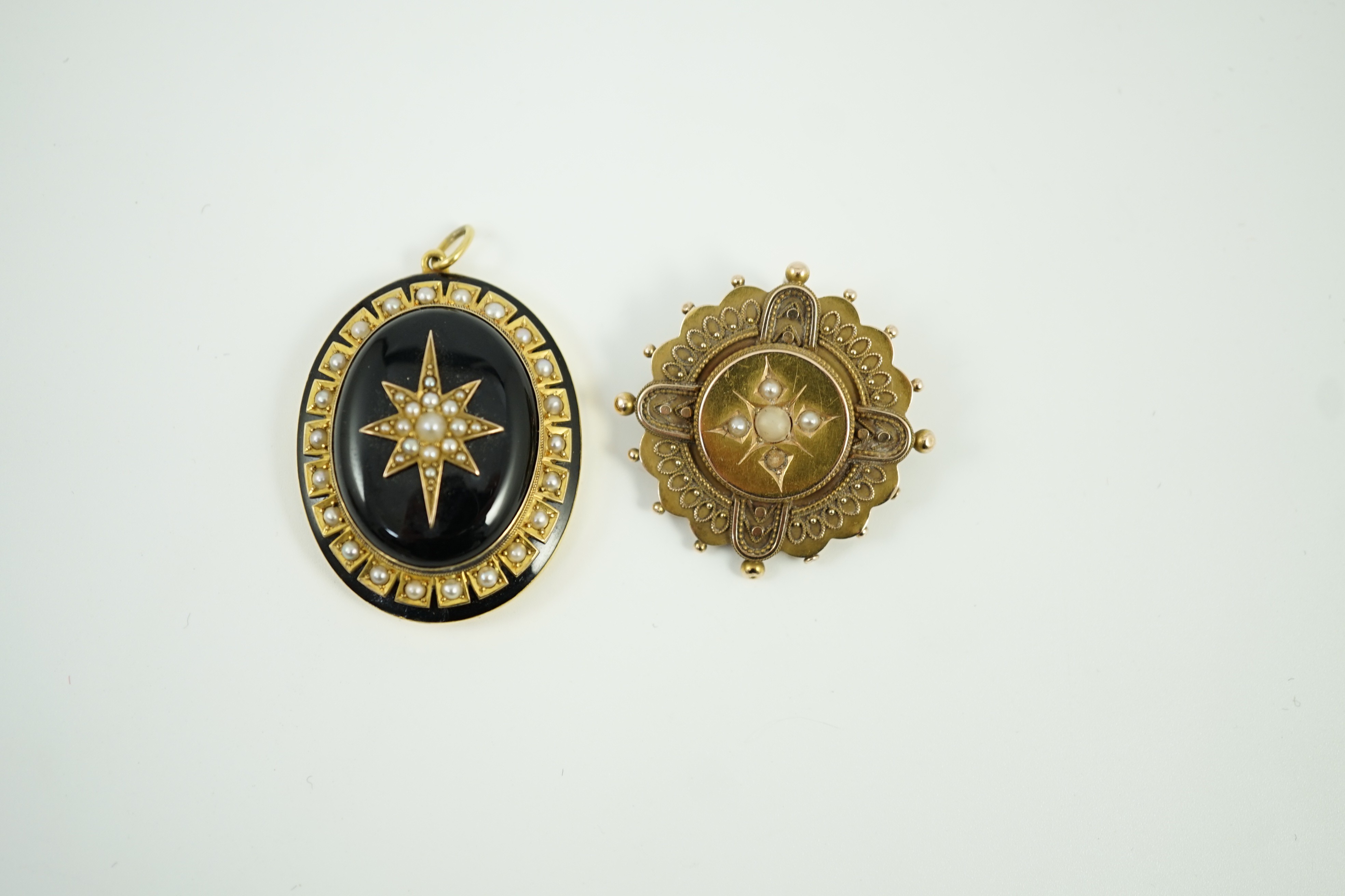 A Victorian yellow metal, black onyx, black enamel and split pearl set oval mourning pendant, 41mm and a Victorian 15ct, coral? and seed pearl set brooch, gross weight 21.5 grams.